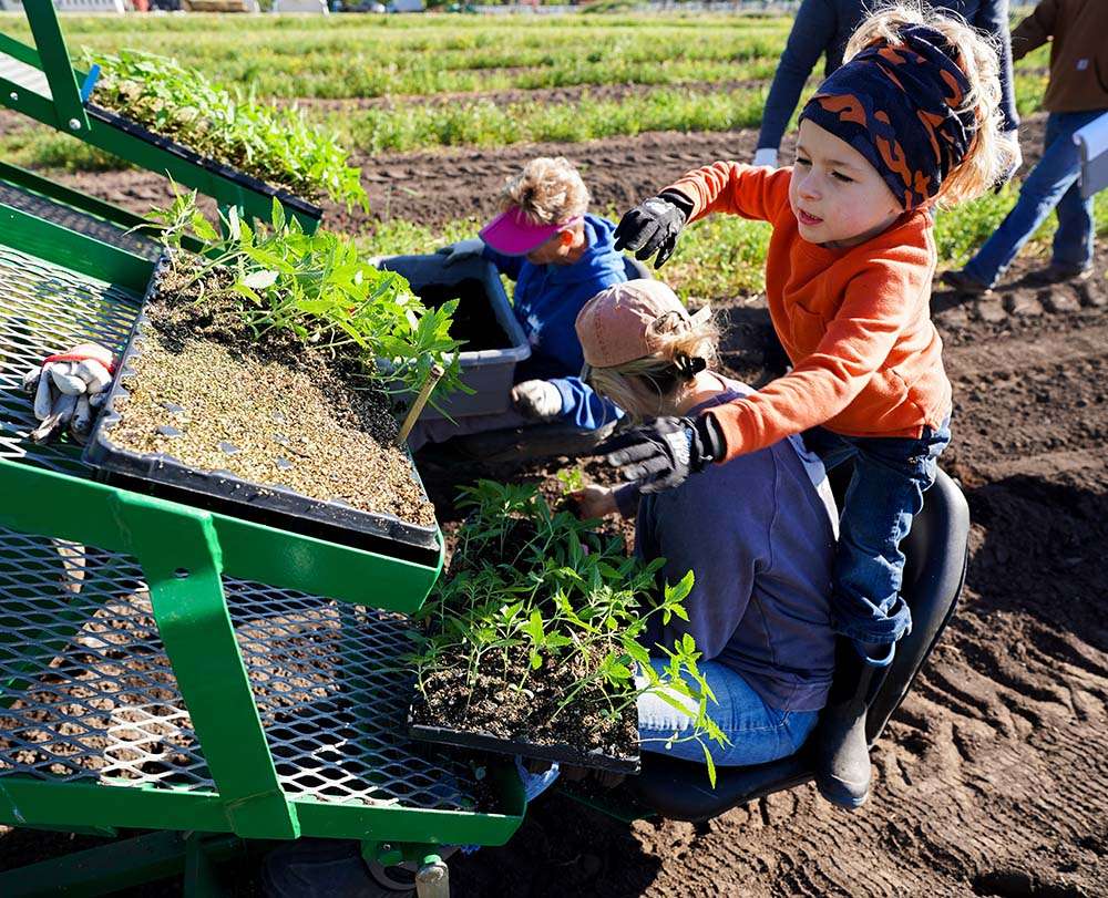 Cooper riding with the planter