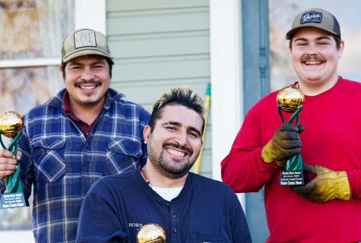 horn creek team members holding awards